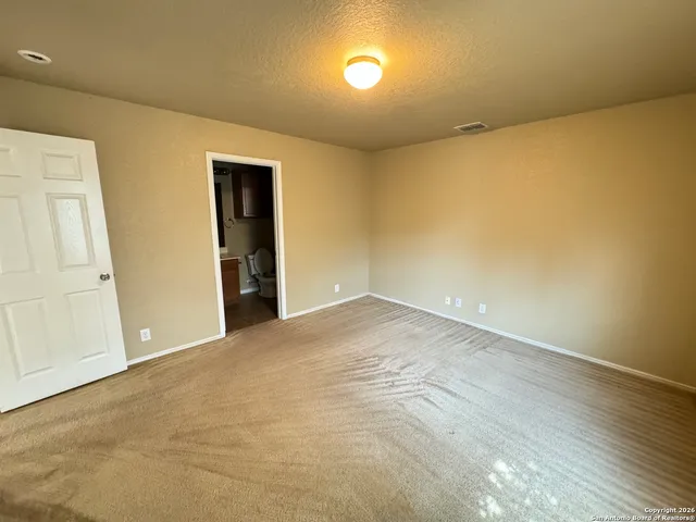a bathroom with a sink a toilet a mirror and vanity
