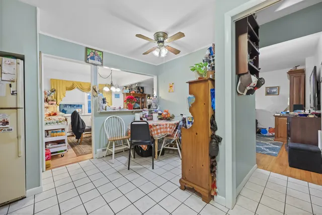 a view of a dining room with furniture and a chandelier