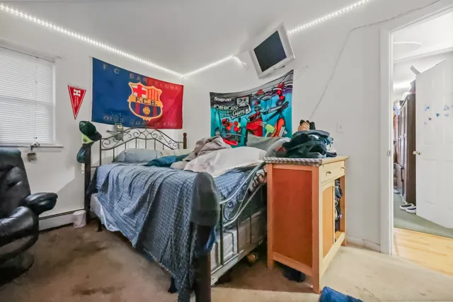 a bedroom with furniture and a bed