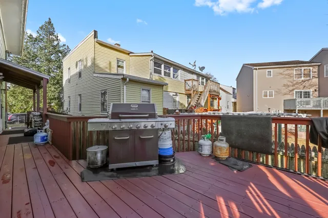 a view of balcony with chairs and wooden floor