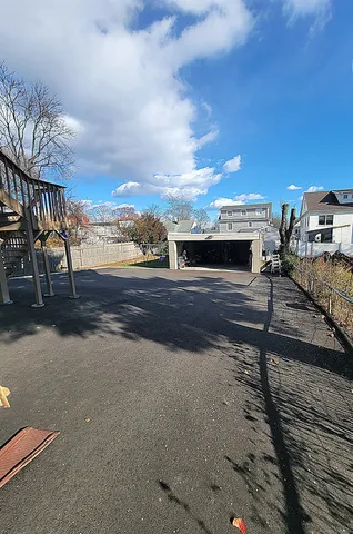 a view of a building with car parked