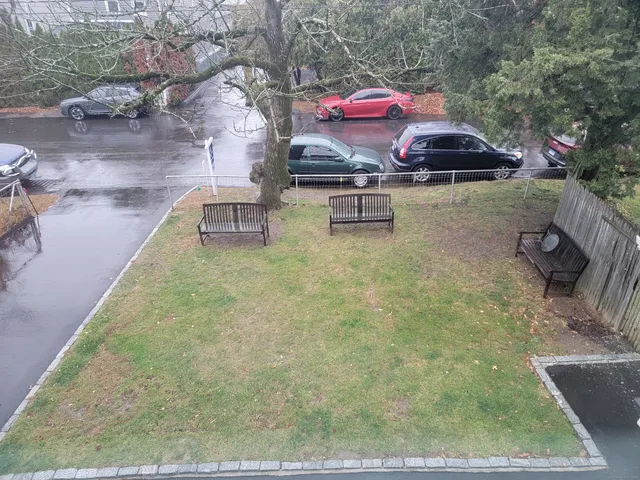 a view of a swimming pool with sitting area
