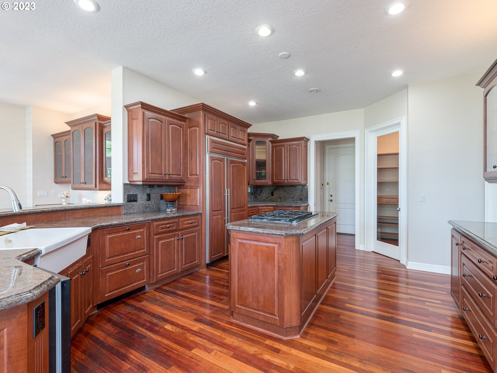 565 Southeast 46th Drive Gresham, OR 97080 - Photo 12 of 48 a kitchen with stainless steel appliances granite countertop a stove and a sink