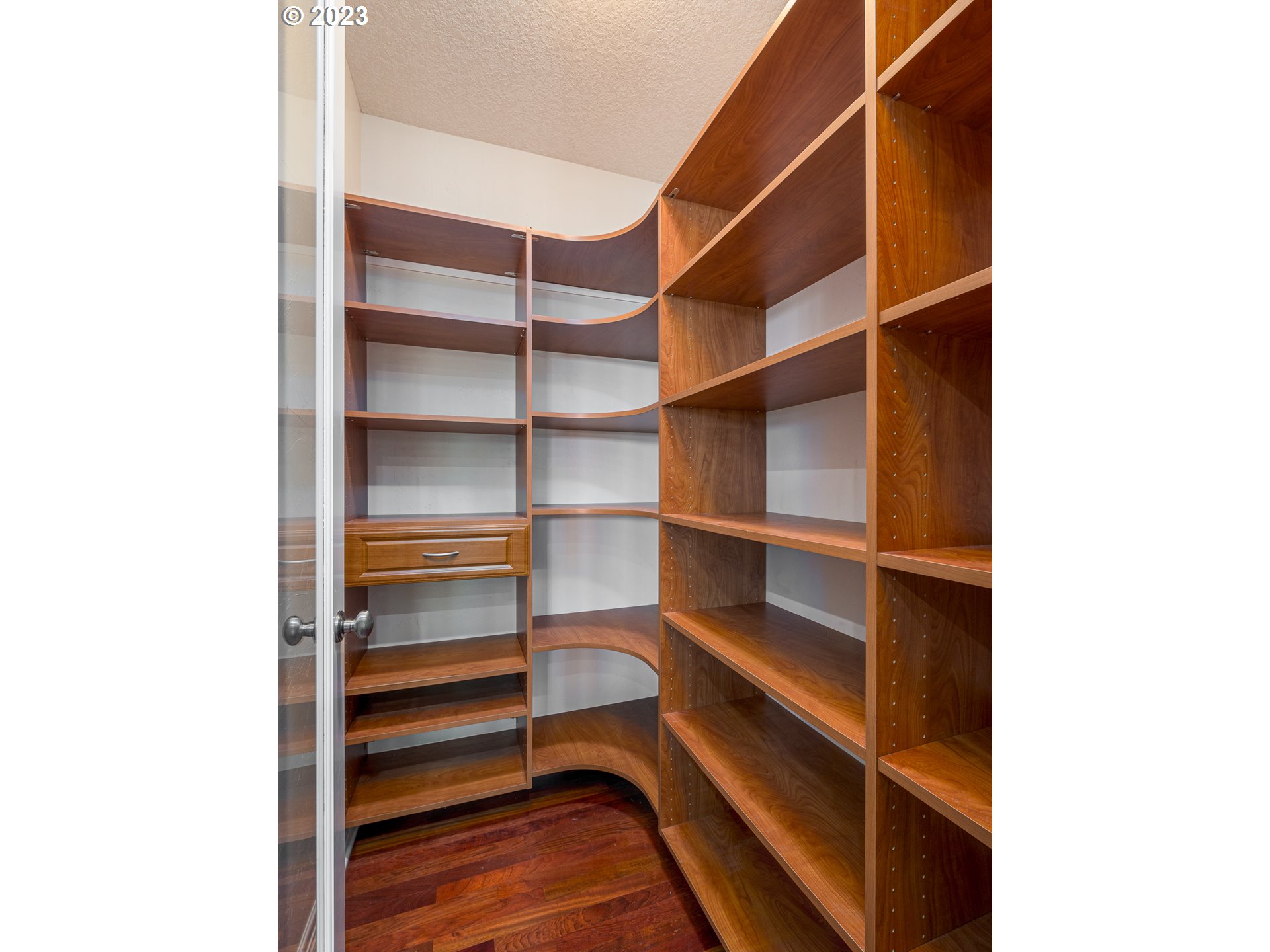 565 Southeast 46th Drive Gresham, OR 97080 - Photo 14 of 48 a view of walk in closet with empty racks