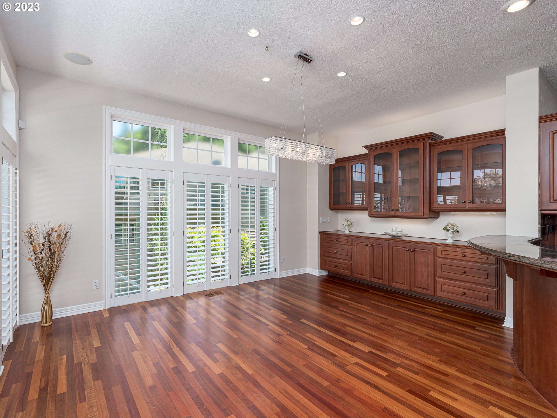 565 Southeast 46th Drive Gresham, OR 97080 - Photo 16 of 48 a large kitchen with stainless steel appliances wooden floor and a large window