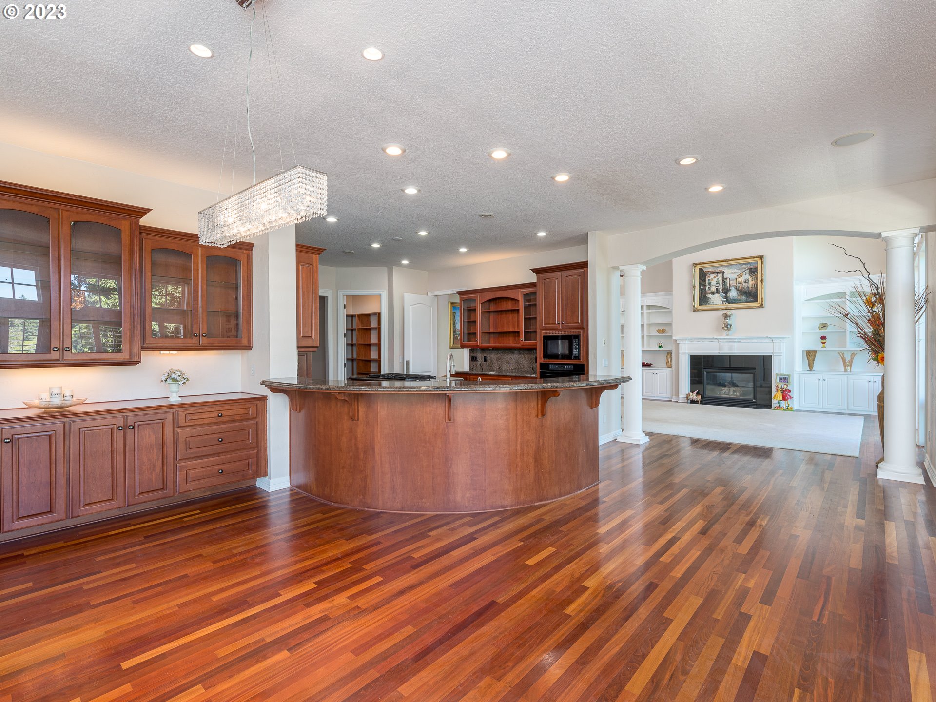 565 Southeast 46th Drive Gresham, OR 97080 - Photo 17 of 48 a large kitchen with cabinets chairs and wooden floor