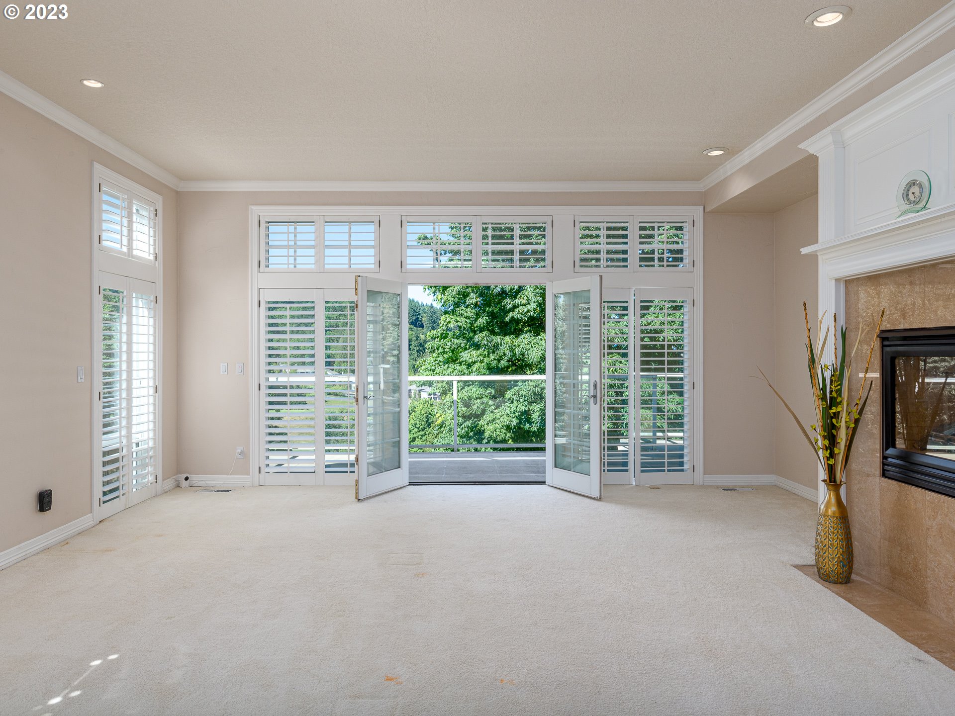 565 Southeast 46th Drive Gresham, OR 97080 - Photo 25 of 48 a view of an empty room with a fireplace and a window