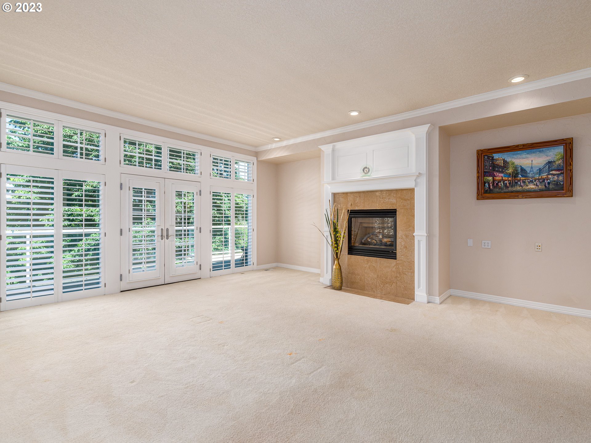 565 Southeast 46th Drive Gresham, OR 97080 - Photo 26 of 48 a view of an empty room with a fireplace and a window