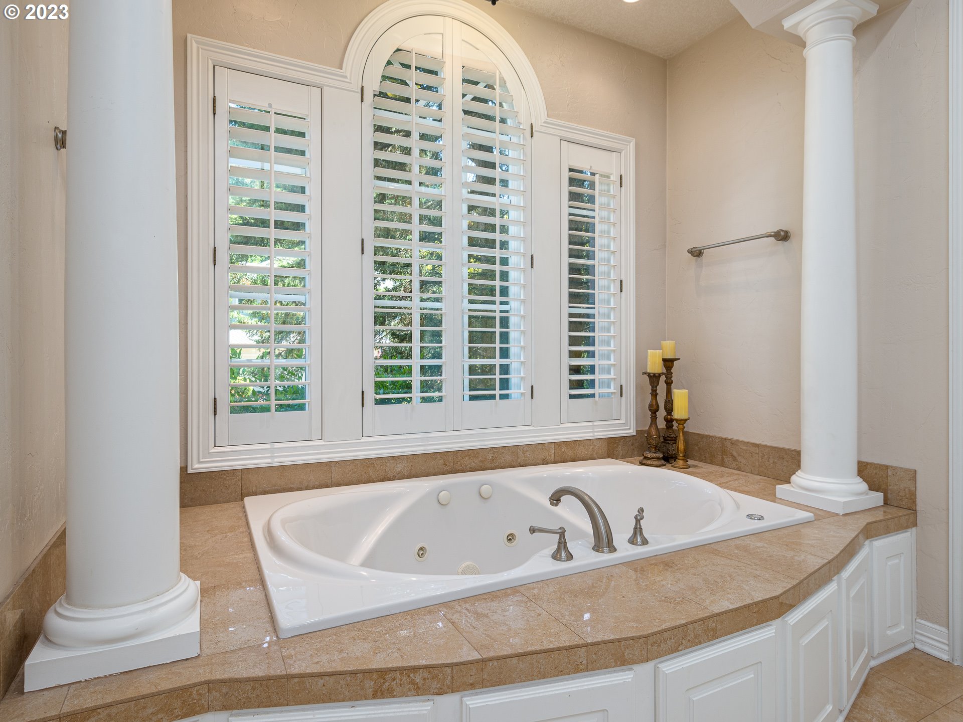 565 Southeast 46th Drive Gresham, OR 97080 - Photo 30 of 48 a bath tub sitting in a bathroom next to a window