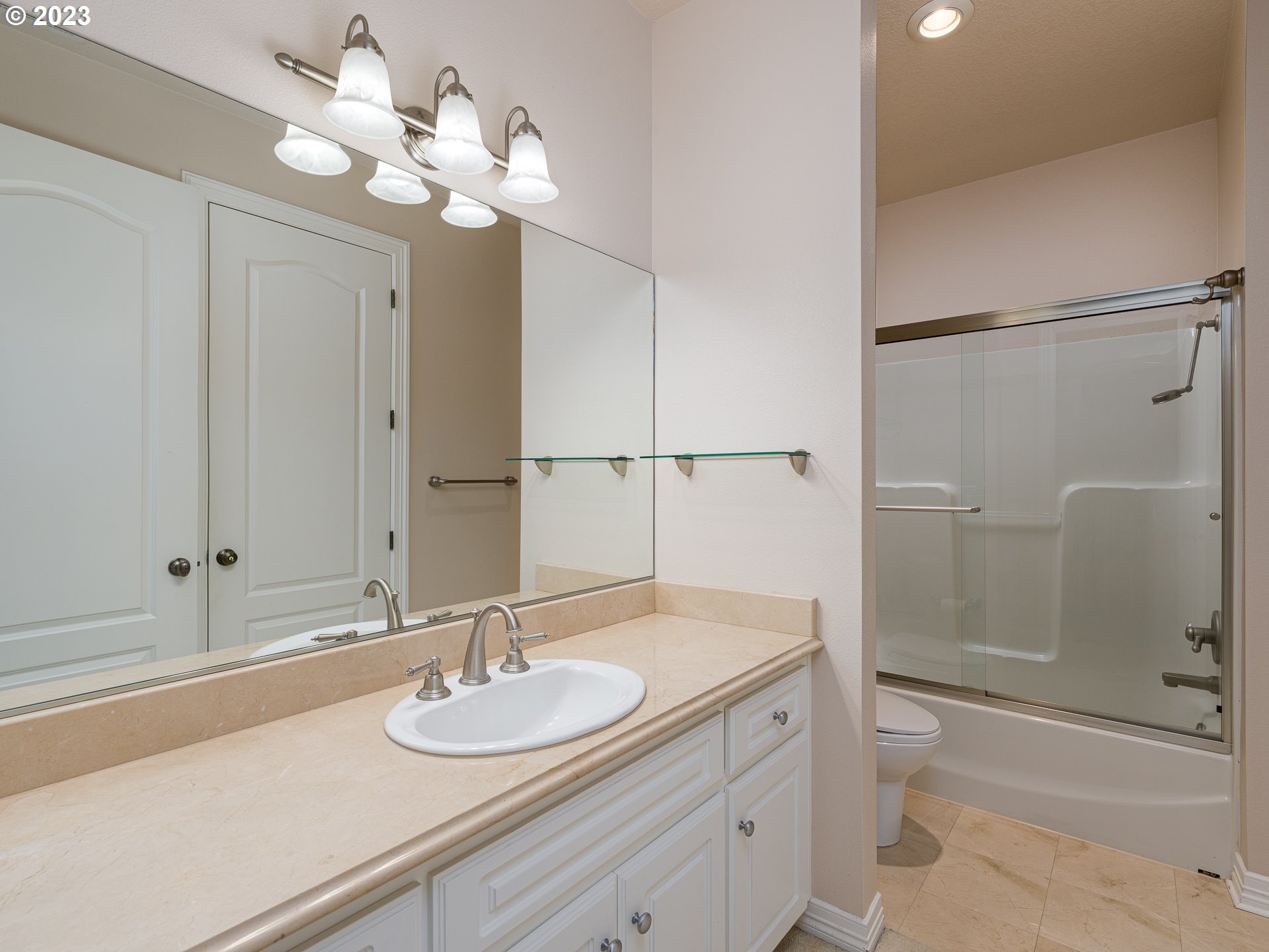 565 Southeast 46th Drive Gresham, OR 97080 - Photo 39 of 48 a bathroom with a granite countertop sink a toilet and shower