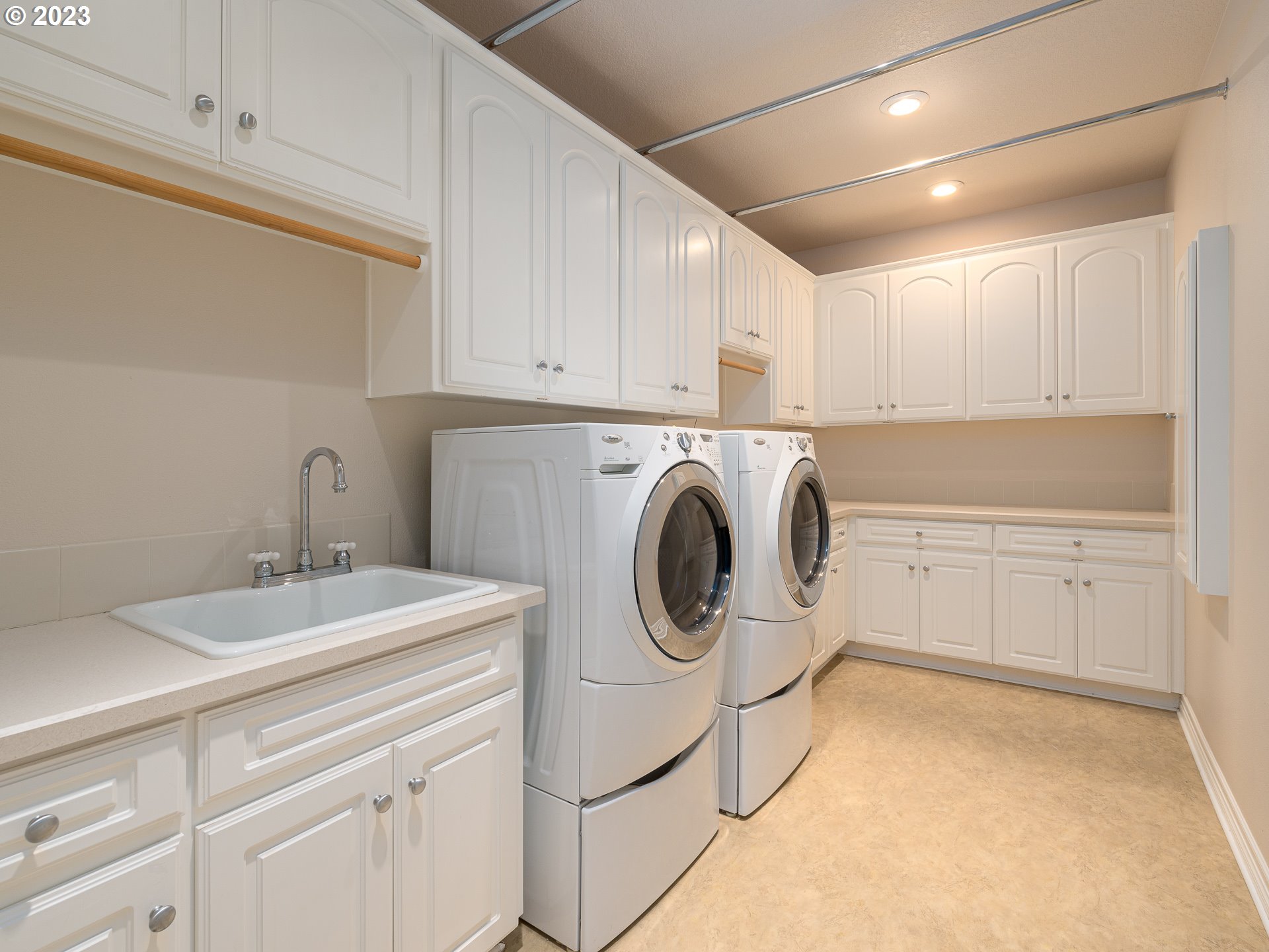 565 Southeast 46th Drive Gresham, OR 97080 - Photo 40 of 48 a utility room with sink dryer and washer