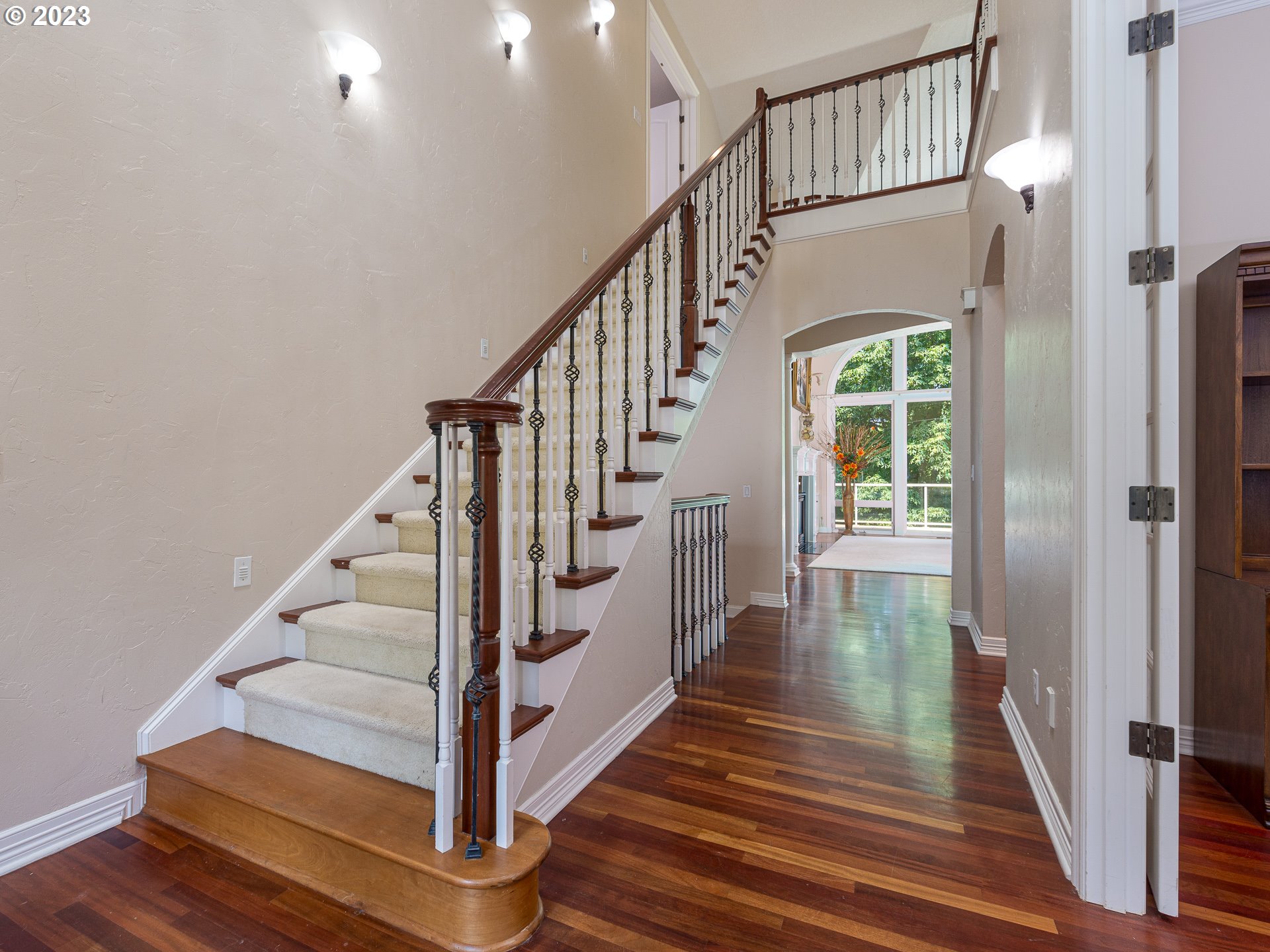 565 Southeast 46th Drive Gresham, OR 97080 - Photo 6 of 48 a view of staircase with wooden floor and a rug