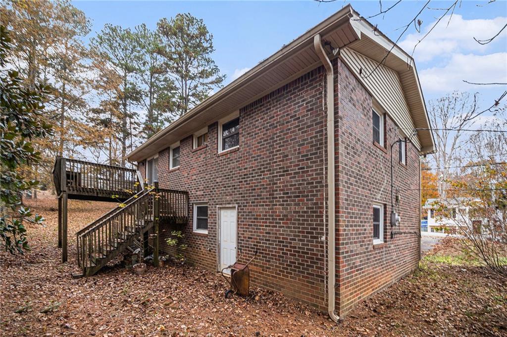 91 Berlin Street Tallapoosa, GA 30176 - Photo 24 of 25 a view of a house with a yard