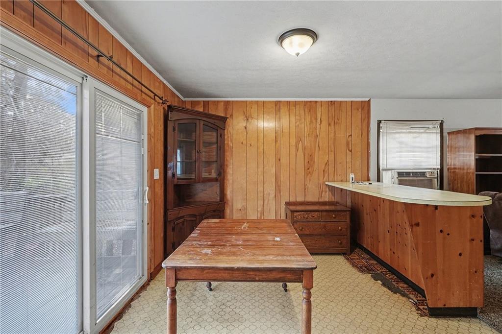 91 Berlin Street Tallapoosa, GA 30176 - Photo 5 of 25 a kitchen with wooden cabinets and sink