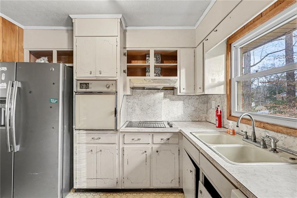 91 Berlin Street Tallapoosa, GA 30176 - Photo 8 of 25 a kitchen with a sink appliances and cabinets