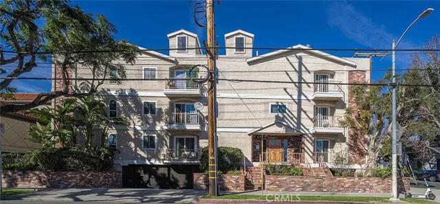 a view of multiple houses with a street