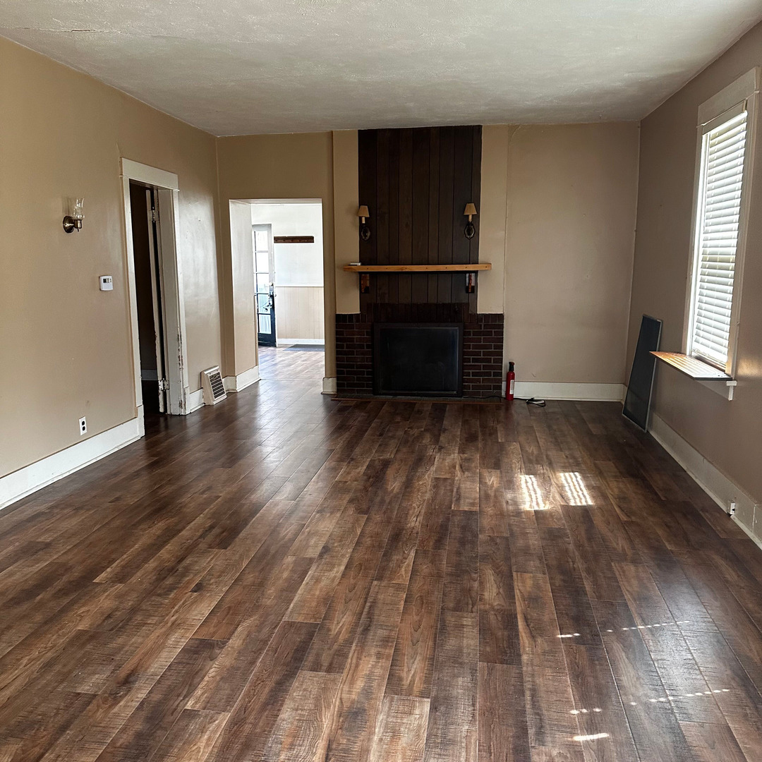 408 Marcy Street Ottawa, IL 61350 - Photo 13 of 25 wooden floor in an empty room with a window