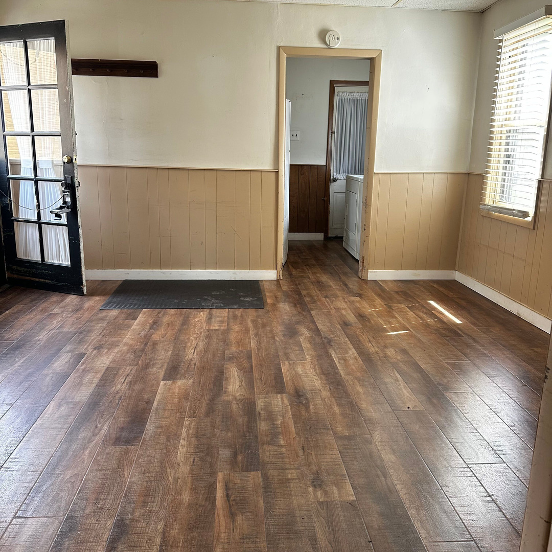 408 Marcy Street Ottawa, IL 61350 - Photo 18 of 25 an empty room with wooden floor and windows