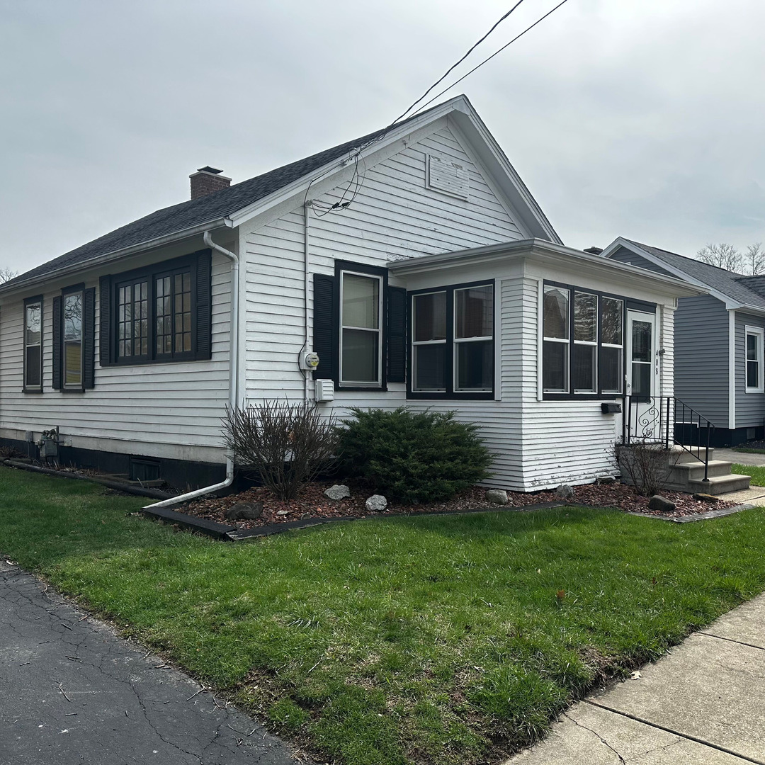 408 Marcy Street Ottawa, IL 61350 - Photo 2 of 25 a front view of a house with a yard and outdoor seating