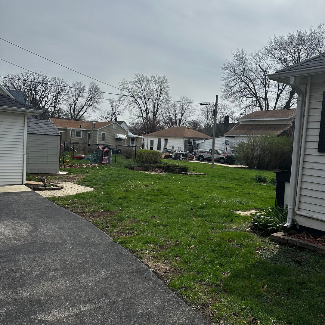 408 Marcy Street Ottawa, IL 61350 - Photo 22 of 25 a view of a backyard with a garden and plants