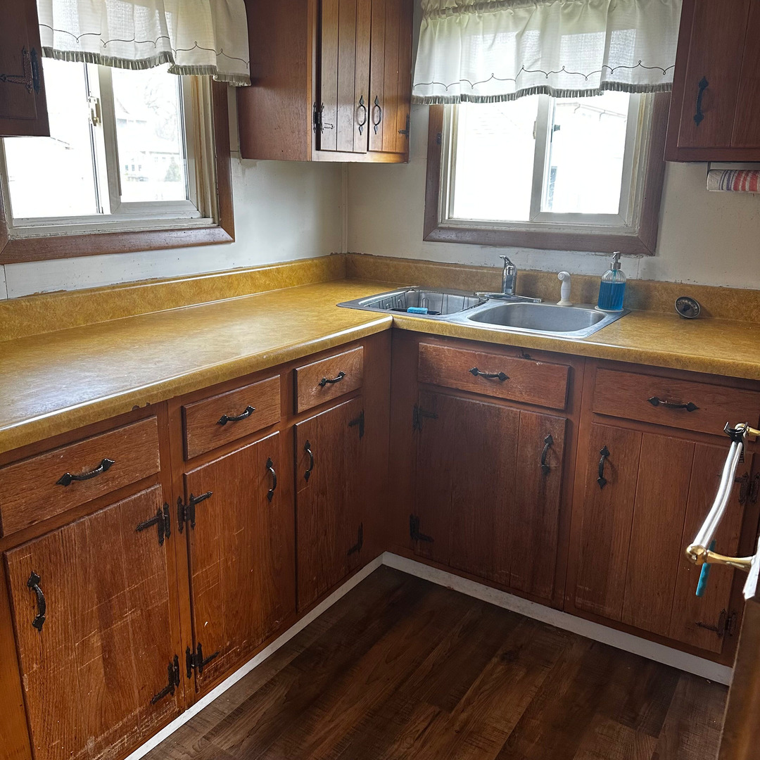 408 Marcy Street Ottawa, IL 61350 - Photo 7 of 25 a view of a kitchen sink cabinets and a window