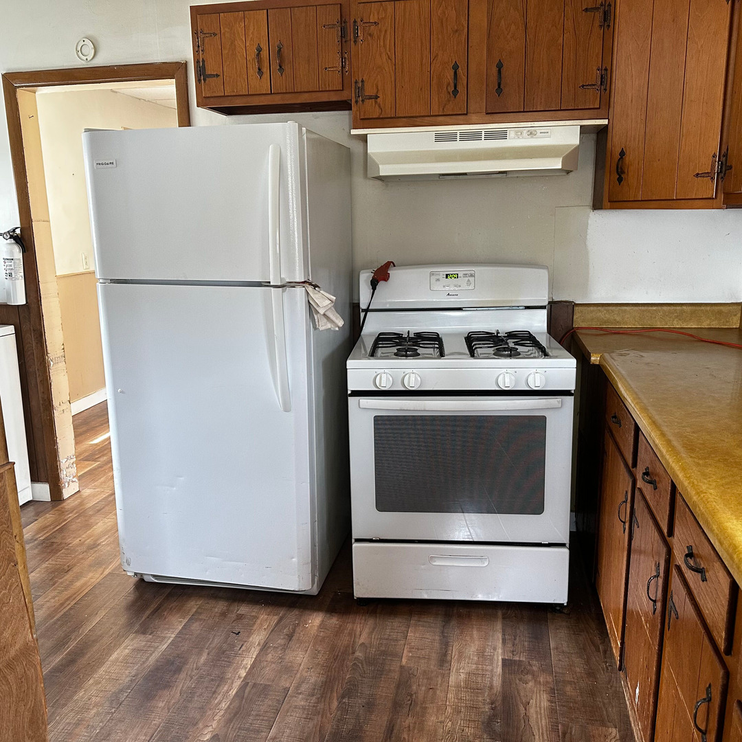 408 Marcy Street Ottawa, IL 61350 - Photo 9 of 25 a kitchen with a stove top oven and cabinets