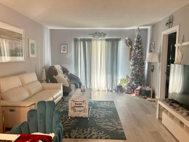 a bedroom with a bed and flat screen tv