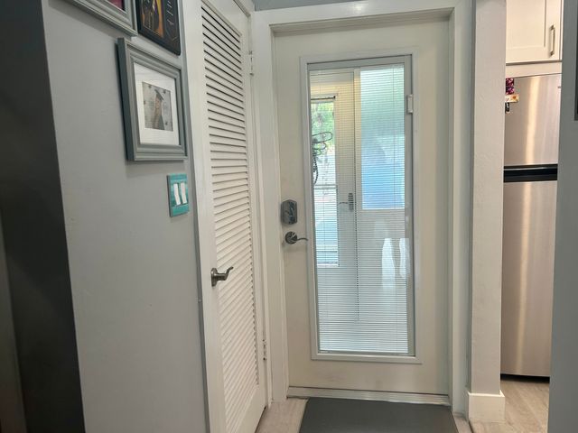 a kitchen with appliances cabinets and a counter top space