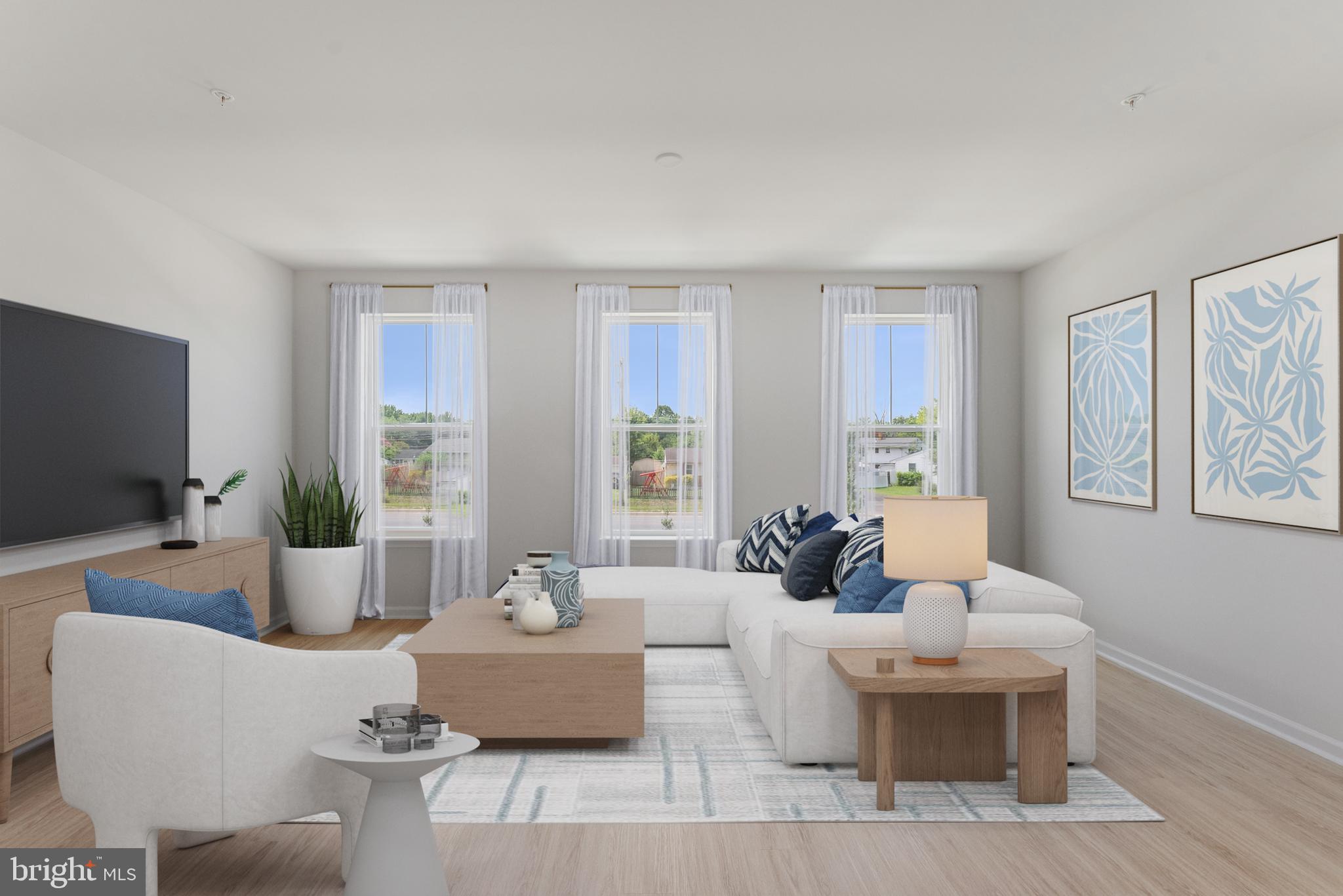 6826 Matthews Road Bryans Road, MD 20616 - Photo 5 of 31 a living room with furniture a large window and a flat screen tv