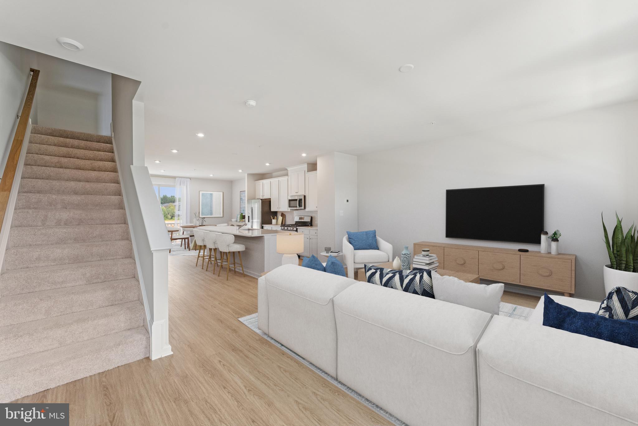 6826 Matthews Road Bryans Road, MD 20616 - Photo 7 of 31 a living room with furniture and a flat screen tv