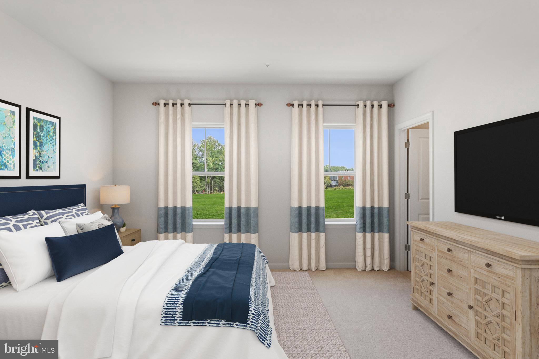 6826 Matthews Road Bryans Road, MD 20616 - Photo 8 of 31 a bedroom with a bed and a flat screen tv