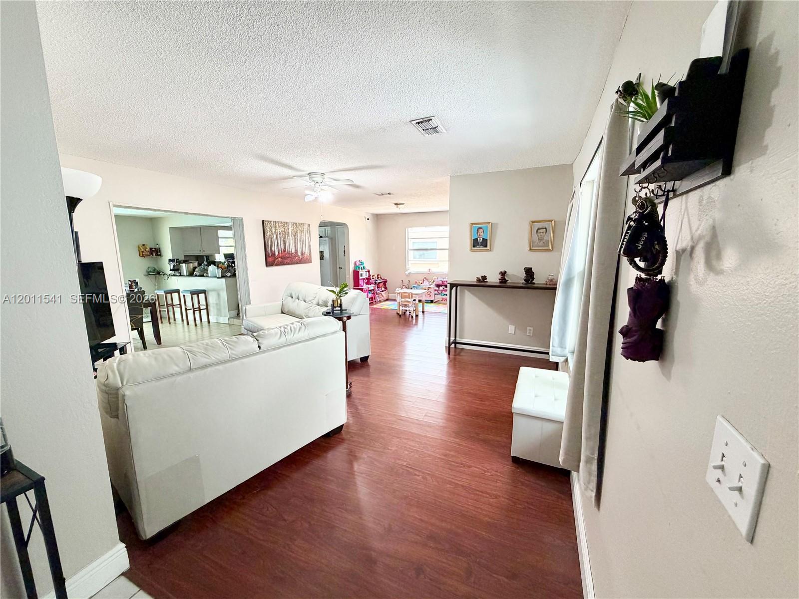 143 Valley Circle Brandon, FL 33510 - Photo 13 of 21 a living room with furniture and a flat screen tv
