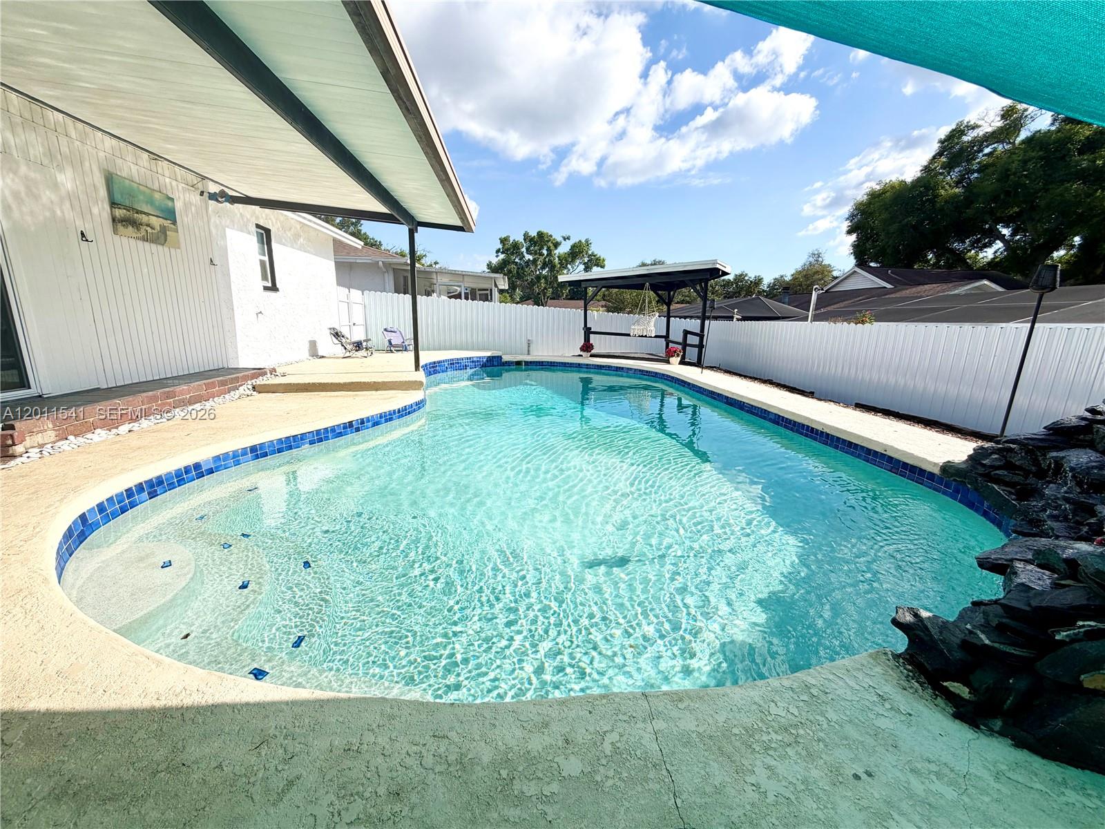 143 Valley Circle Brandon, FL 33510 - Photo 5 of 21 a view of swimming pool with a yard
