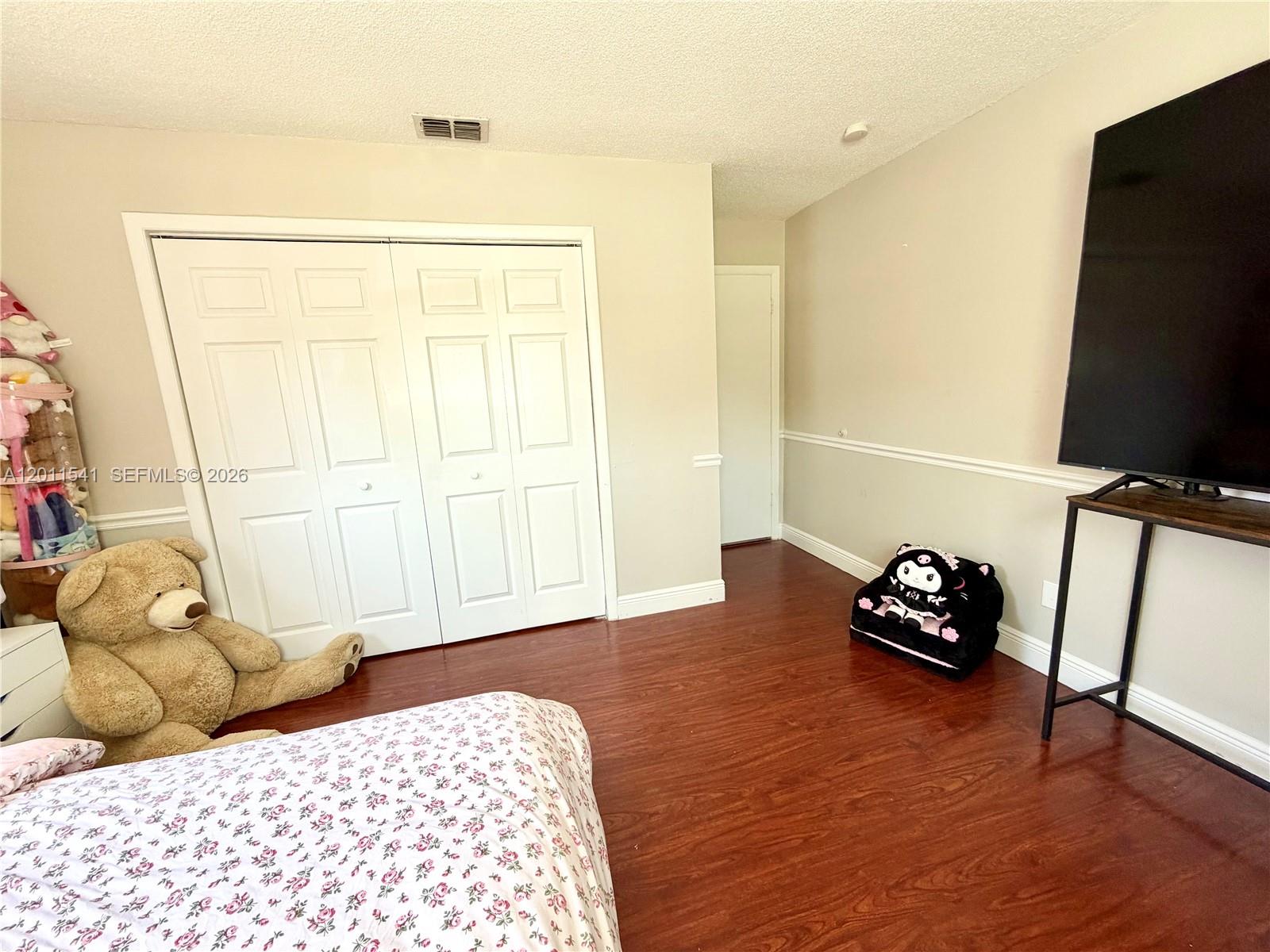 143 Valley Circle Brandon, FL 33510 - Photo 8 of 21 a bedroom with a bed and a window
