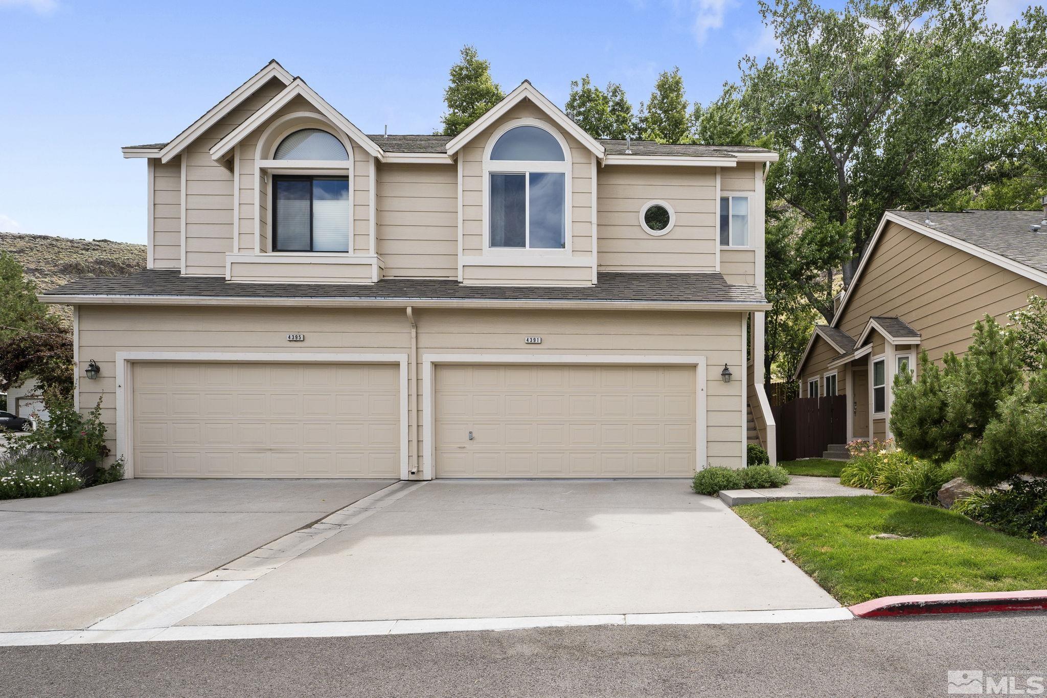 4391 Loreto Lane Reno, NV 89502 - Photo 1 of 39 a view of front of house with a yard and garage