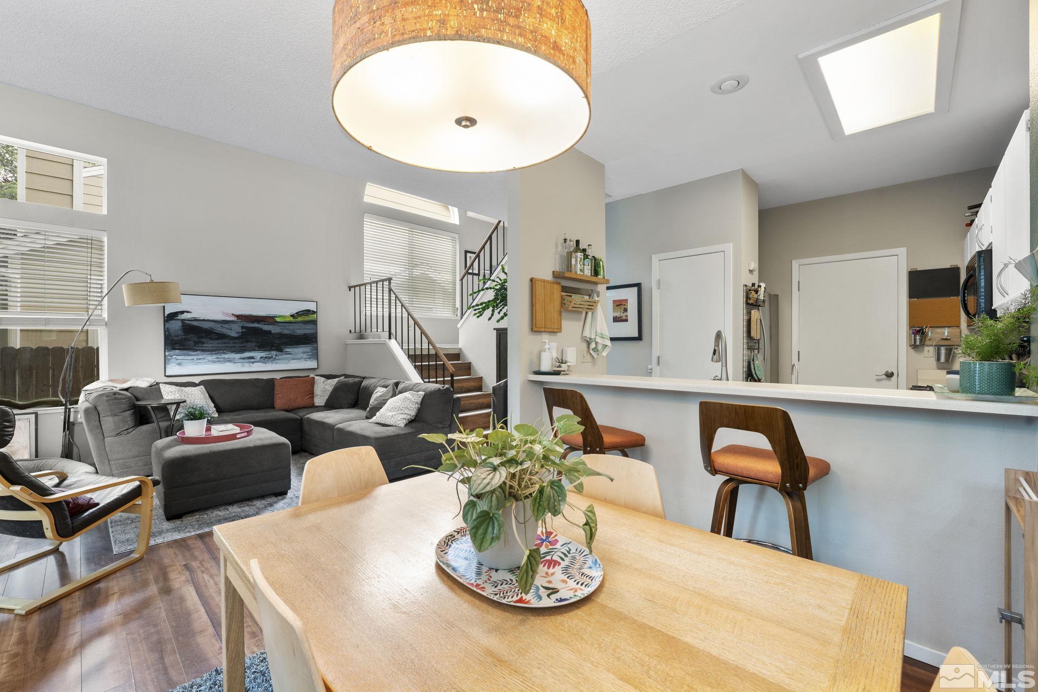 4391 Loreto Lane Reno, NV 89502 - Photo 13 of 39 a living room with furniture and a dining table