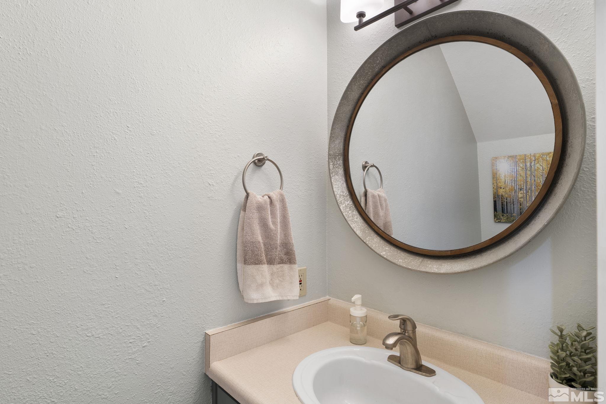 4391 Loreto Lane Reno, NV 89502 - Photo 18 of 39 a bathroom with a sink and a mirror
