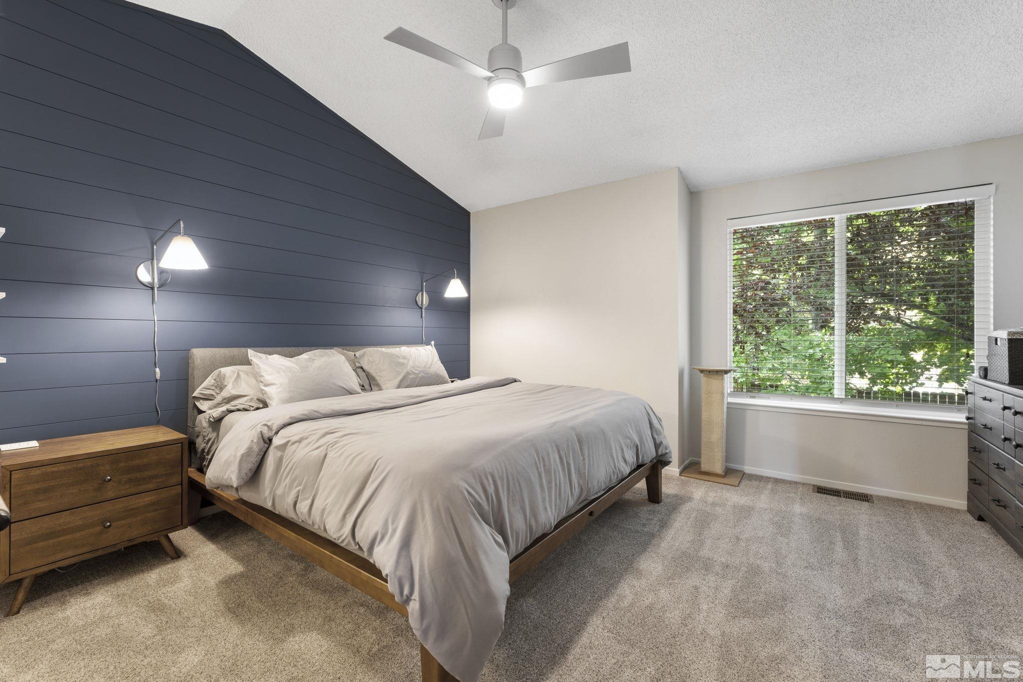 4391 Loreto Lane Reno, NV 89502 - Photo 19 of 39 a bedroom with a bed and large window