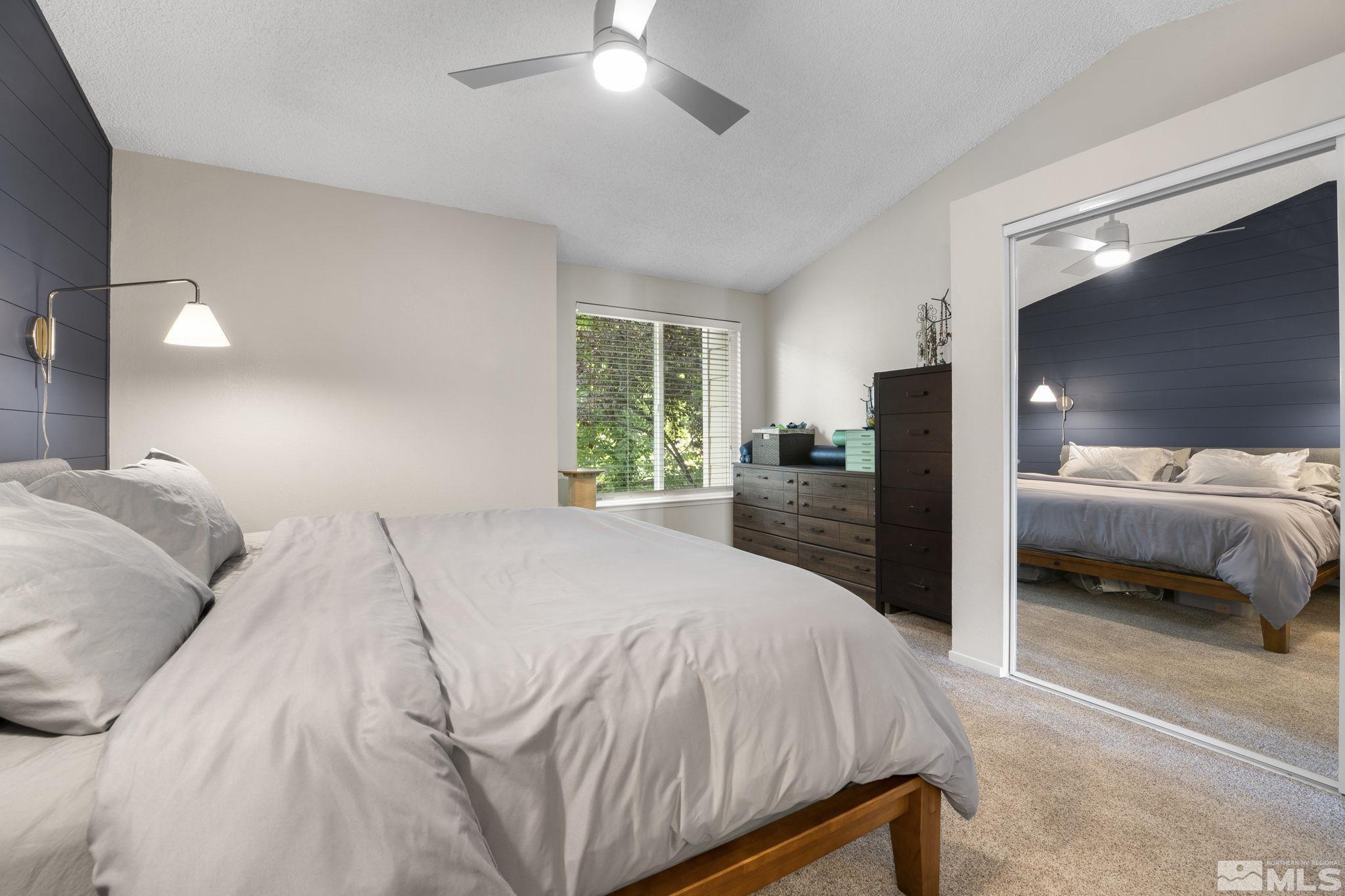 4391 Loreto Lane Reno, NV 89502 - Photo 20 of 39 a bedroom with a large bed and a large window