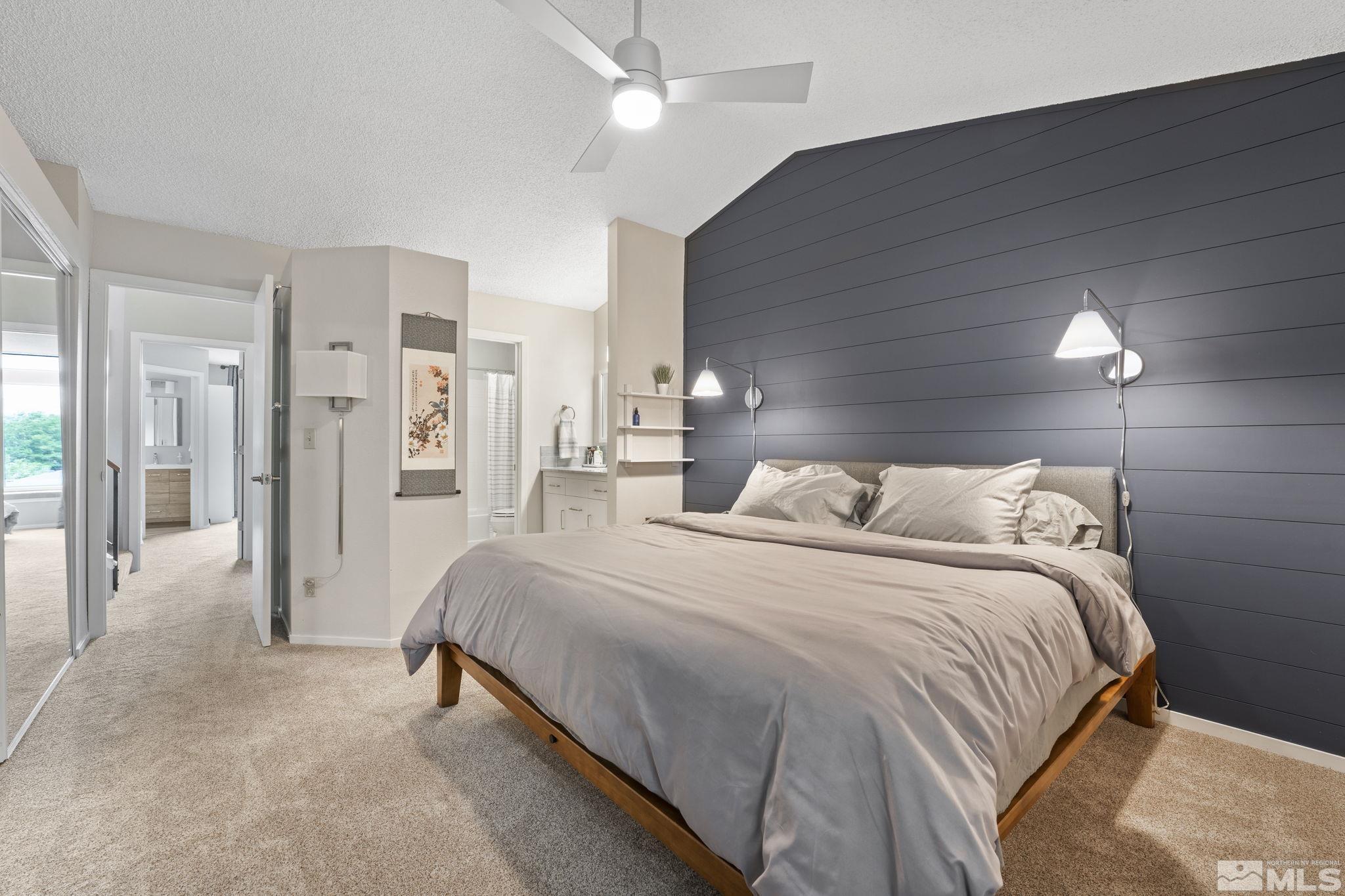 4391 Loreto Lane Reno, NV 89502 - Photo 21 of 39 a spacious bedroom with a bed and a walk in closet