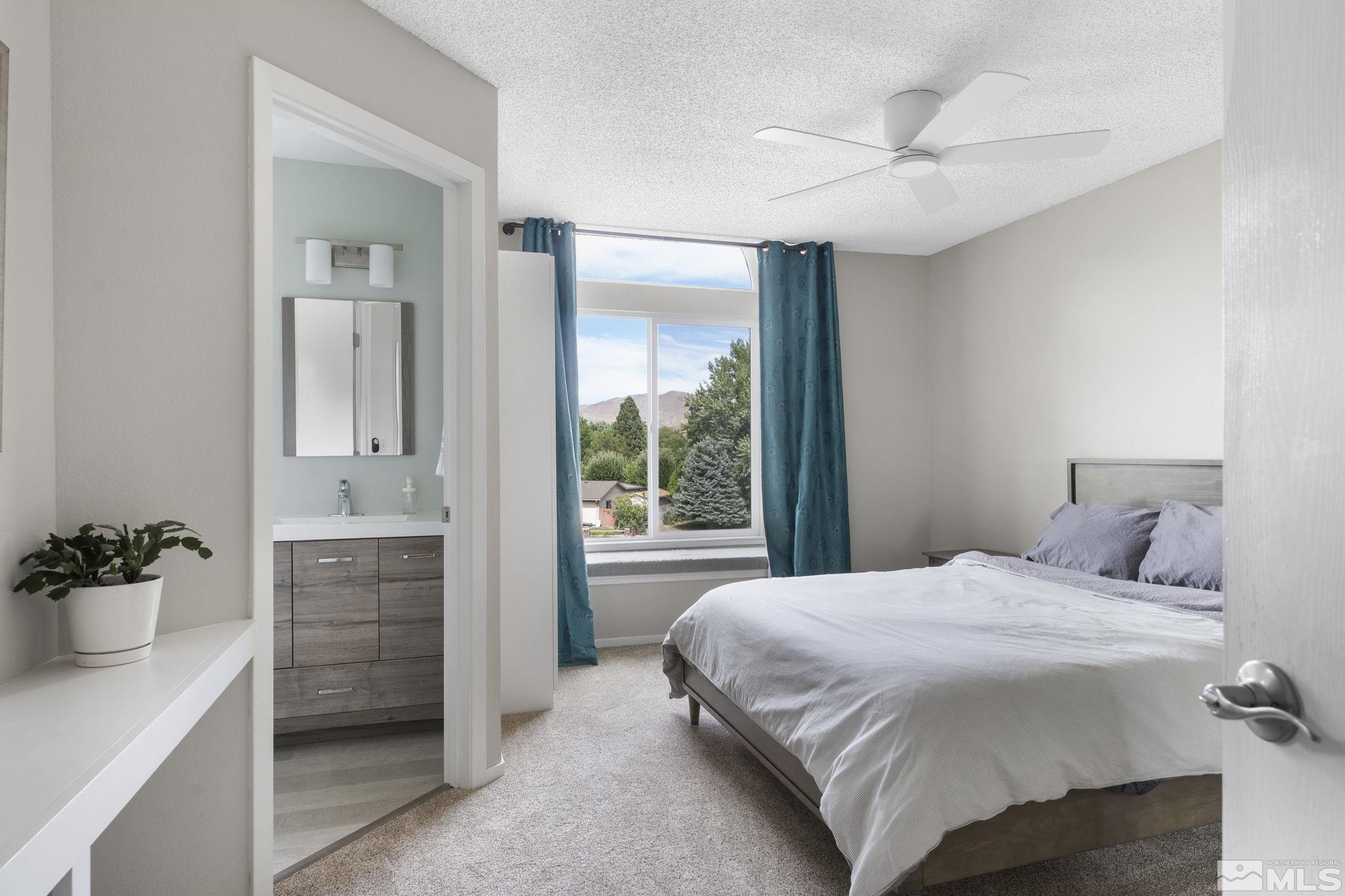 4391 Loreto Lane Reno, NV 89502 - Photo 24 of 39 a bedroom with a bed and a dresser