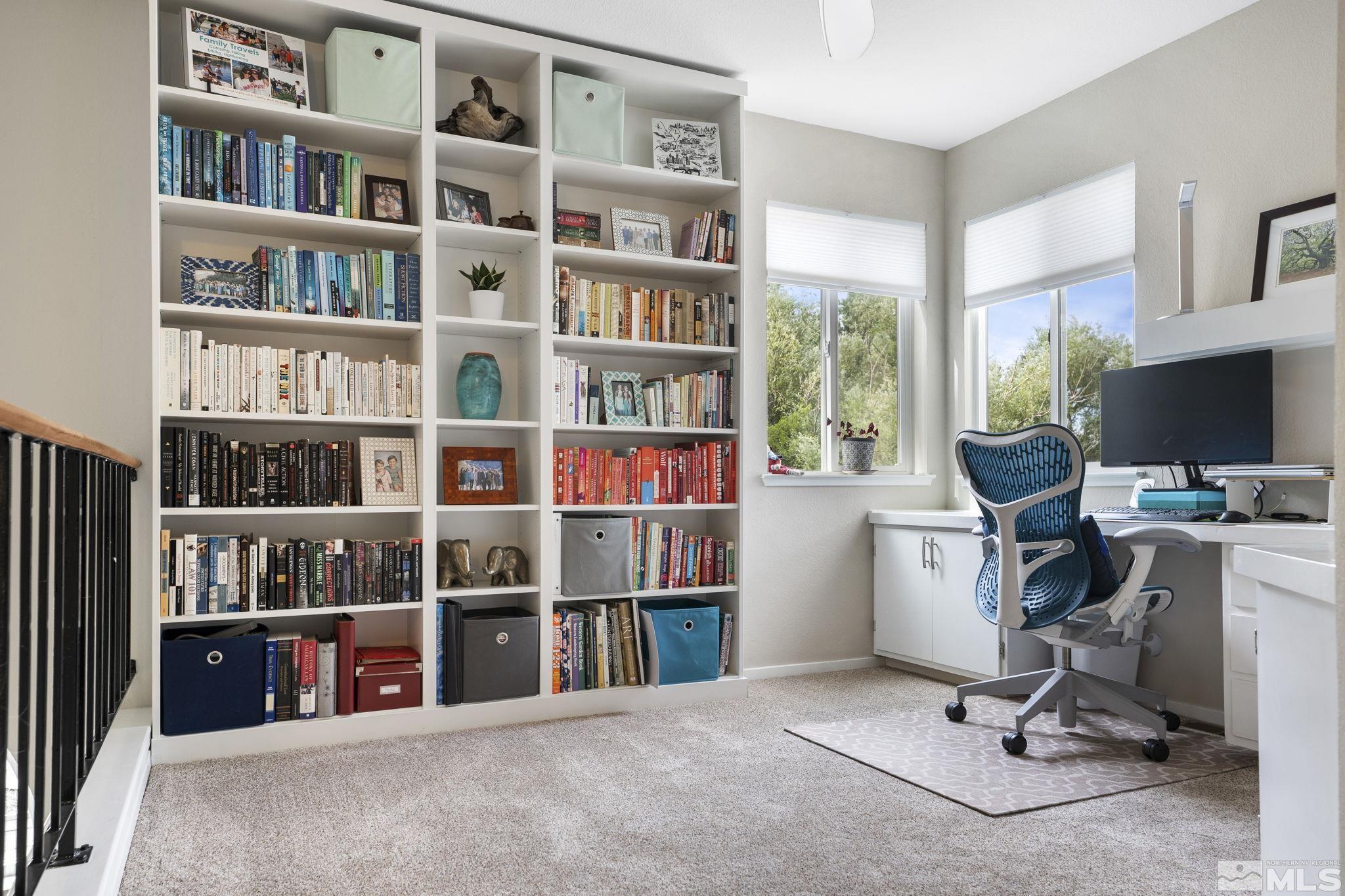 4391 Loreto Lane Reno, NV 89502 - Photo 28 of 39 a view of a workspace with bookshelf and a window