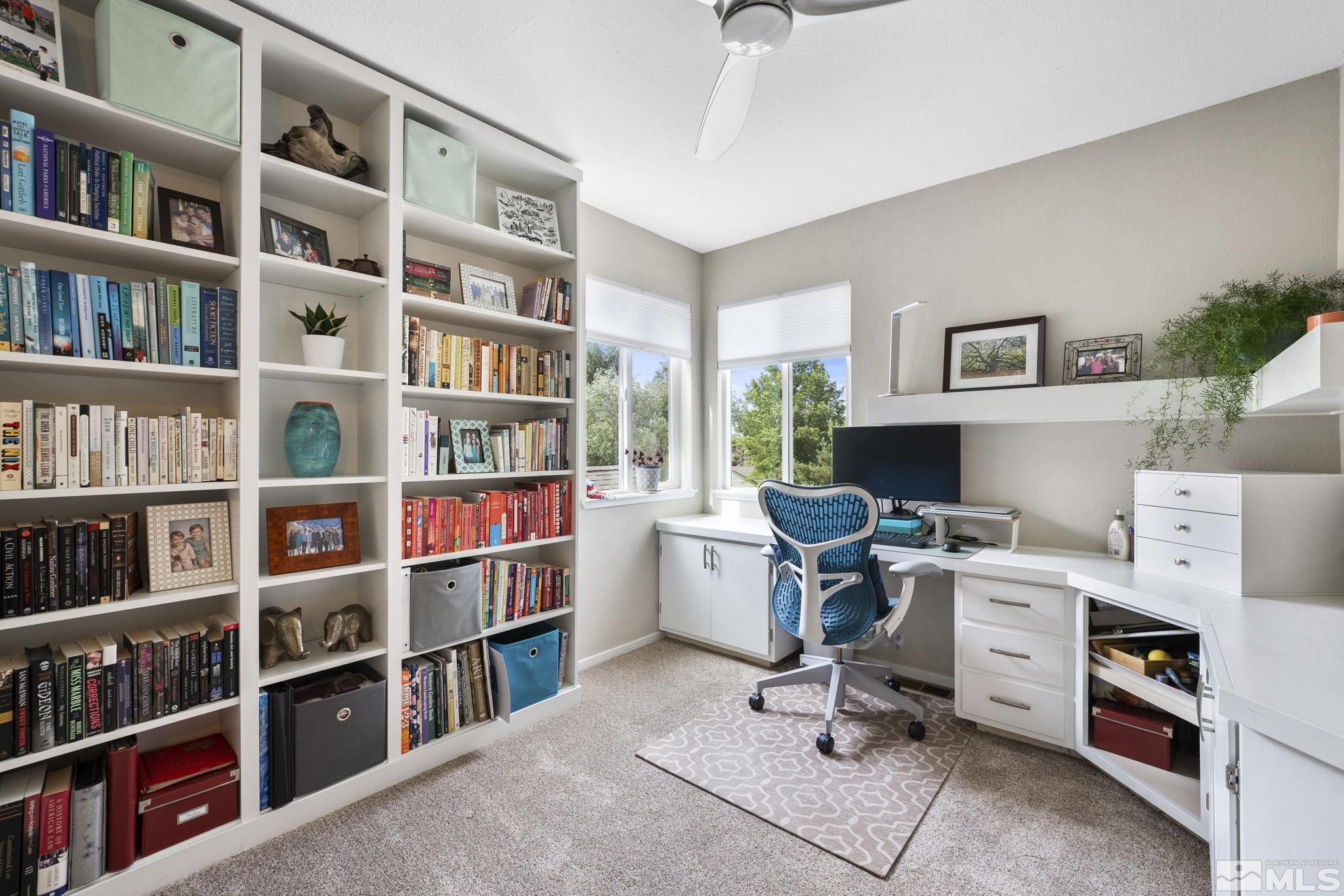 4391 Loreto Lane Reno, NV 89502 - Photo 29 of 39 a view of a workspace with bookshelf and a workspace