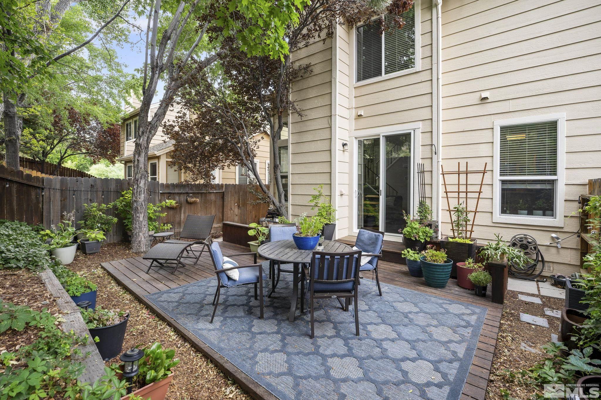 4391 Loreto Lane Reno, NV 89502 - Photo 35 of 39 a wooden bench sitting in front of a house