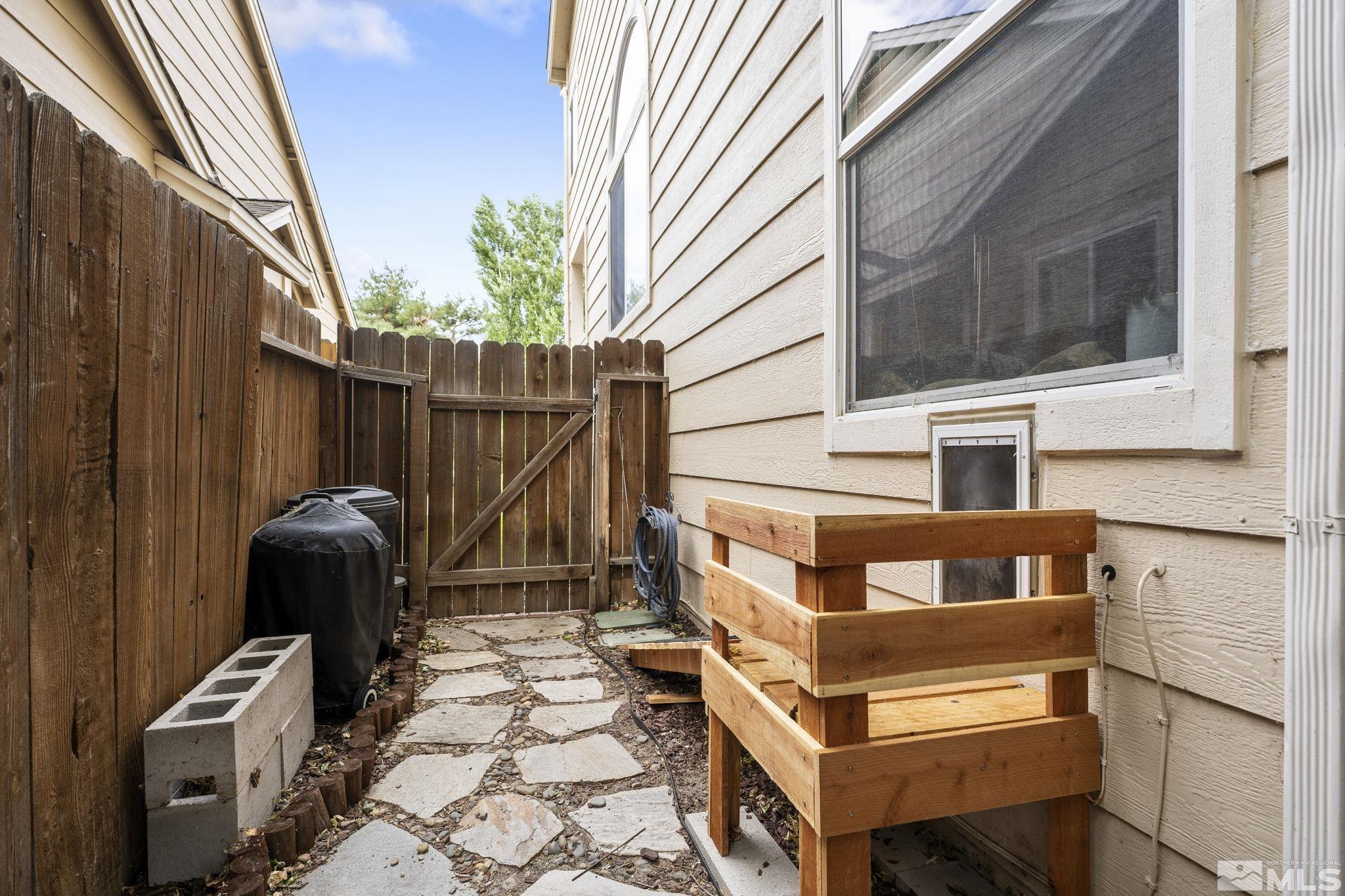 4391 Loreto Lane Reno, NV 89502 - Photo 39 of 39 a view of a balcony with chairs and a potted plant