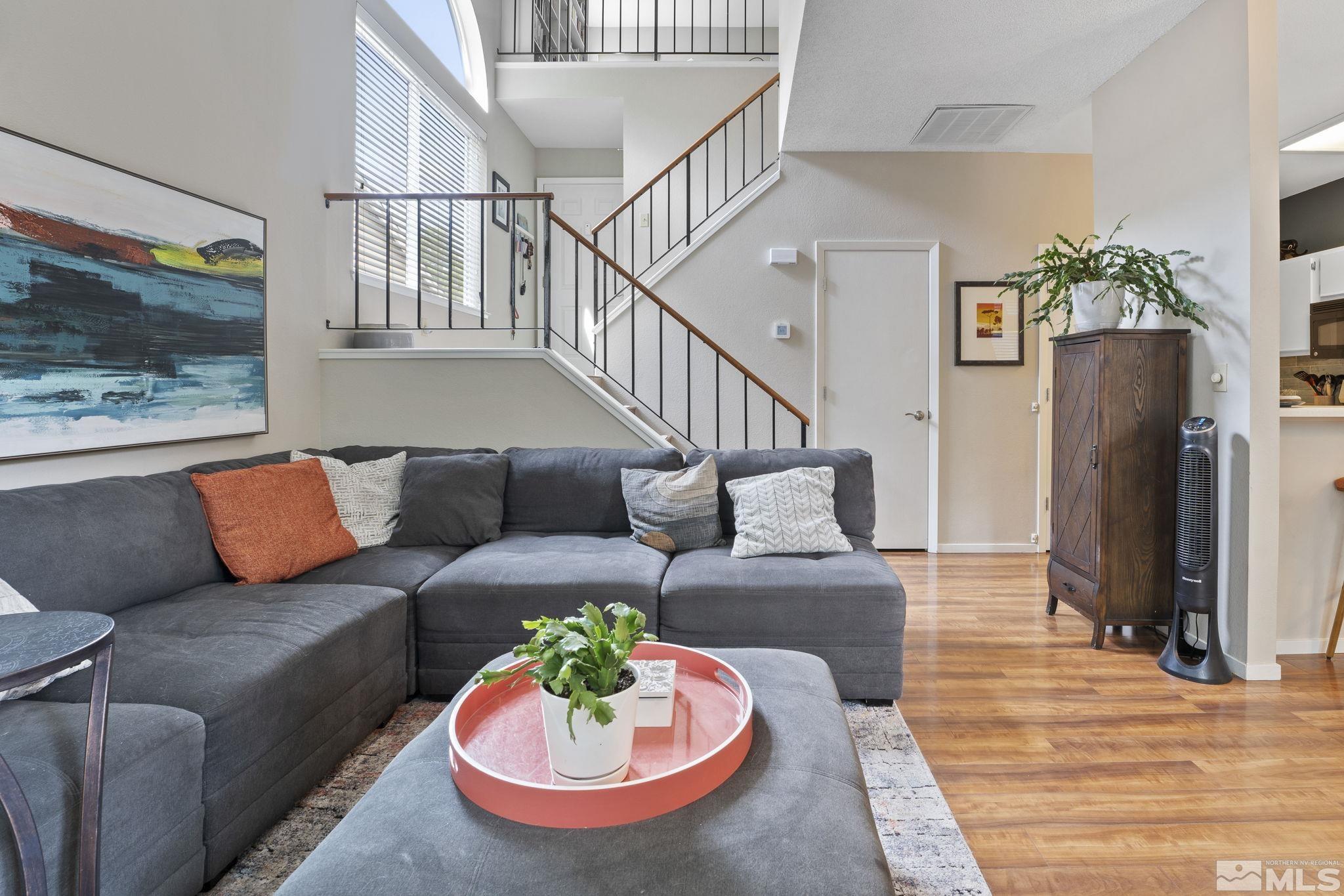 4391 Loreto Lane Reno, NV 89502 - Photo 10 of 39 a living room with furniture and a flat screen tv