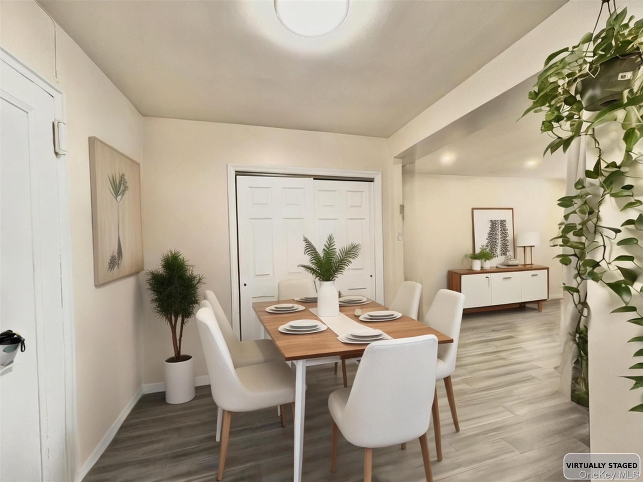 138-12 28th Road, Unit 1F Queens, NY 11354 - Photo 2 of 8 a view of a dining room with furniture and wooden floor