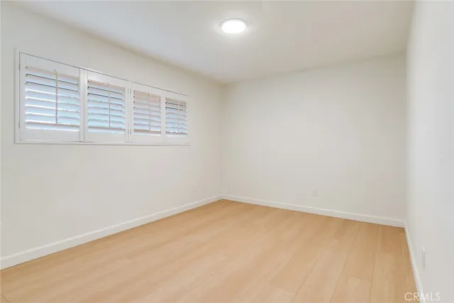 a bathroom with a sink toilet vanity and shower