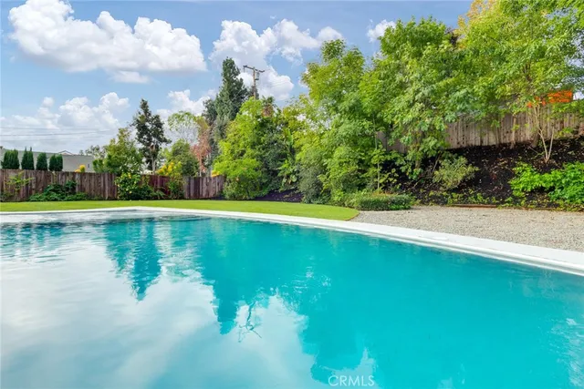 an aerial view of a house with yard