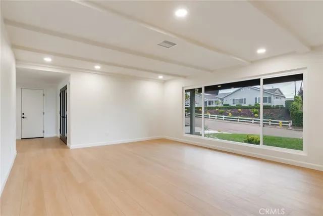 a view of an empty room with glass door